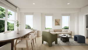 Photos coming soon! - Rending shown. Living room with light wood-style floors and recessed lighting