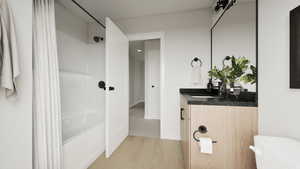 Photos coming soon! - Rending shown. Bathroom with vanity, light wood-style flooring, and shower / tub combo
