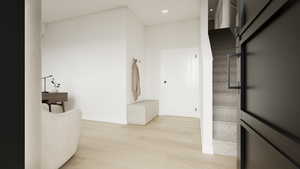 Photos coming soon! - Rending shown. Corridor with light wood-type flooring, recessed lighting, and a high ceiling