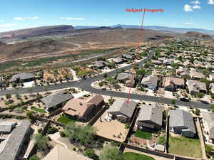 Aerial perspective of suburban area featuring a mountain backdrop