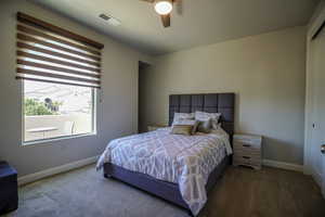 Bedroom 2 with carpet flooring, a ceiling fan, and a closet