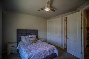 Bedroom 2 with carpet, a closet, and ceiling fan