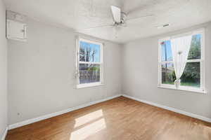 Spare room featuring light wood-type flooring and a ceiling fan