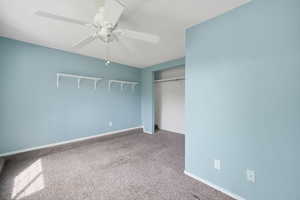 Unfurnished bedroom with light colored carpet, a closet, and ceiling fan