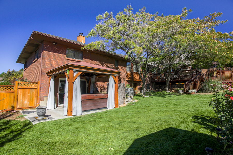 Lower patio with included gazebo and working hot tub (included) Enters into Fam room downstairs