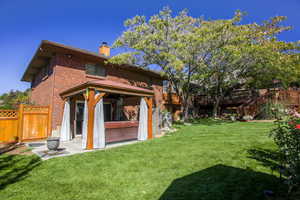 Lower patio with included gazebo and working hot tub (included) Enters into Fam room downstairs