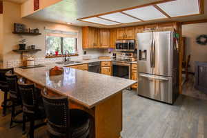 Kitchen has updated sink & faucet. All Smart stainless steele appliances including fridge. Bar seating at counter
