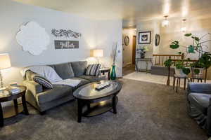 This home boasts multiple social spaces with two just on the interior main floor. Entry leads to formal dining area.