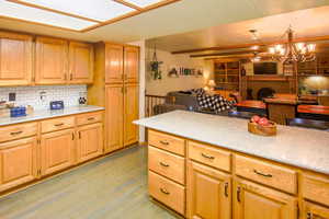 Kitchen Has a lot of cabinetry and counter space. Newer quartz countertops. Dining has boxed window
