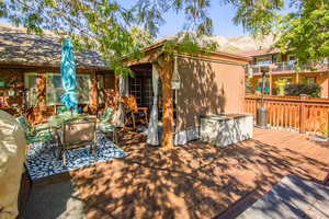 Deck is accessed thru Great room for additional social space. plumbed for gas BBQ or. Wide steps to backyard