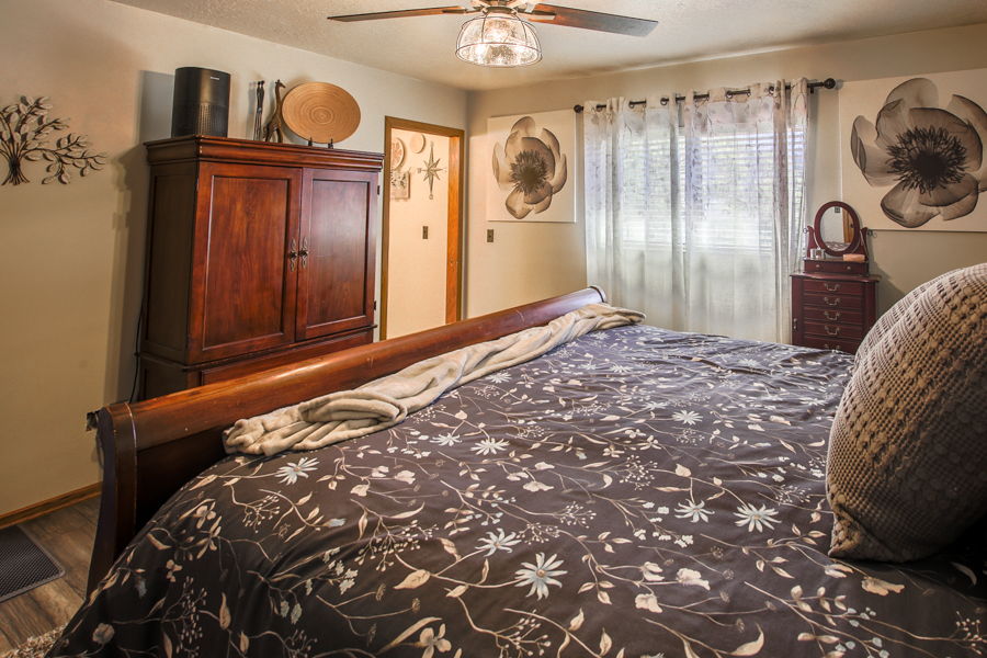 Primary Bedroom with ensuite bath. Big view windows with great light & ceiling fan