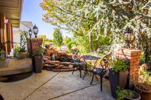 View of patio courtyard area. Lovely koi pond with soothing fountain. Get your zen while you gaze at Ben Lomond.