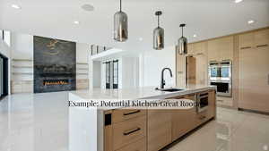 Kitchen with light wood finish cabinets, a premium fireplace, light stone counters, an island with sink, and stainless steel appliances