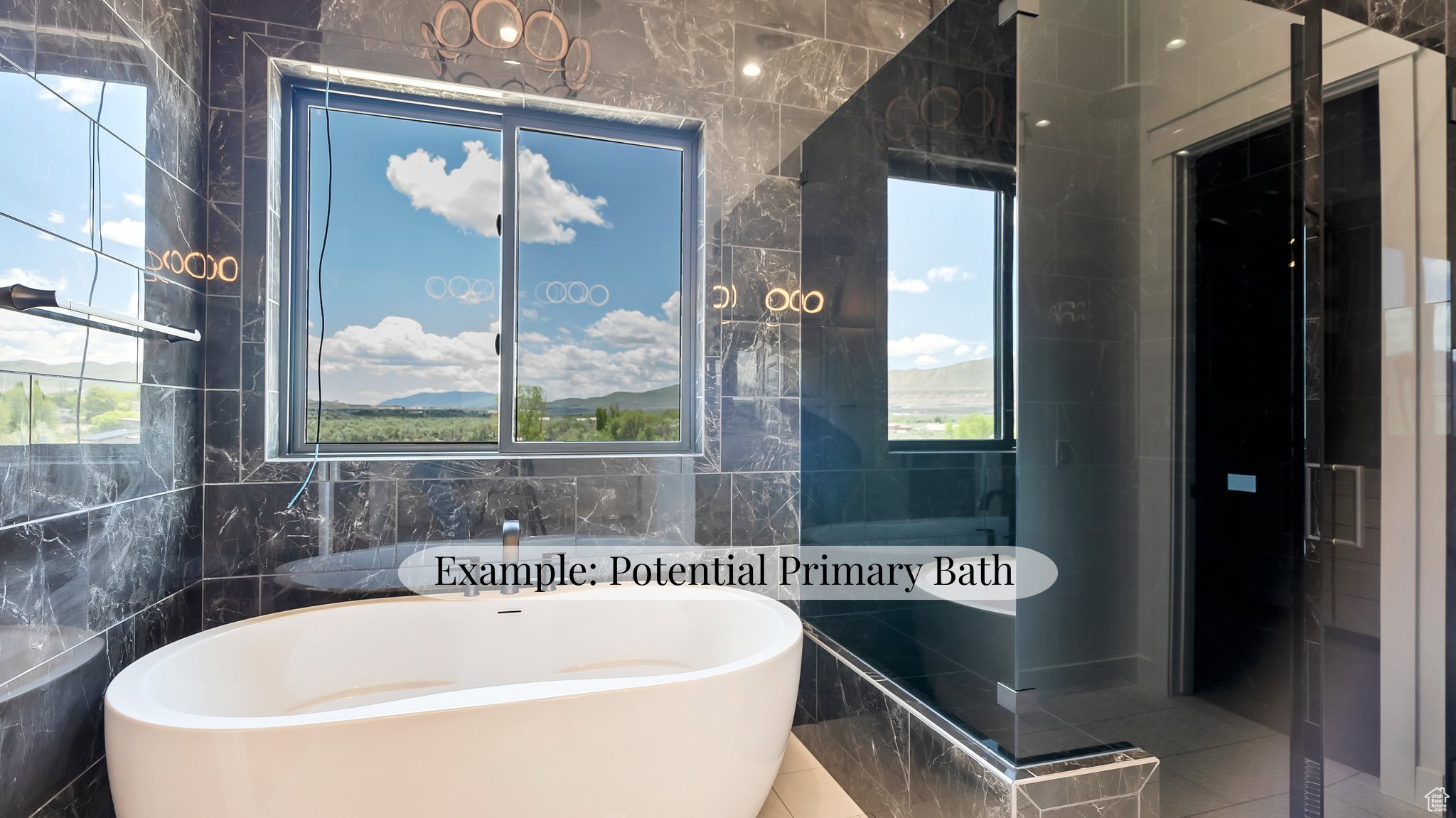 Bathroom featuring tile walls, a freestanding bath, and a shower stall