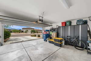 Garage featuring a garage door opener