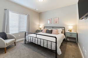 Bedroom featuring carpet