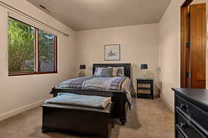 Carpeted bedroom with baseboards