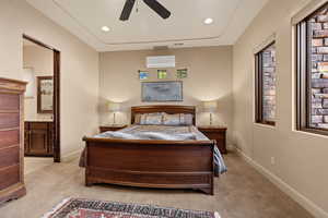 Bedroom featuring connected bathroom, light colored carpet, ceiling fan, and recessed lighting