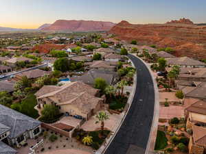 Aerial view of residential area featuring a mountainous background