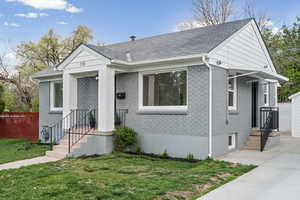Bungalow-style house featuring brick siding