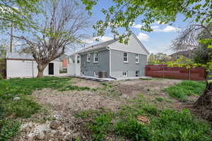 Rear view of property featuring a patio area