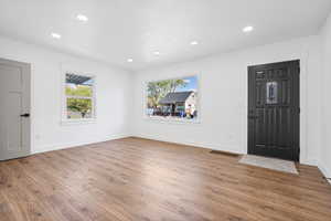 Foyer entrance featuring light wood-type flooring and recessed lighting