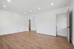 Unfurnished room with recessed lighting and light wood-style floors