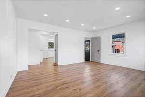 Spare room featuring recessed lighting, light wood-style flooring, and healthy amount of natural light