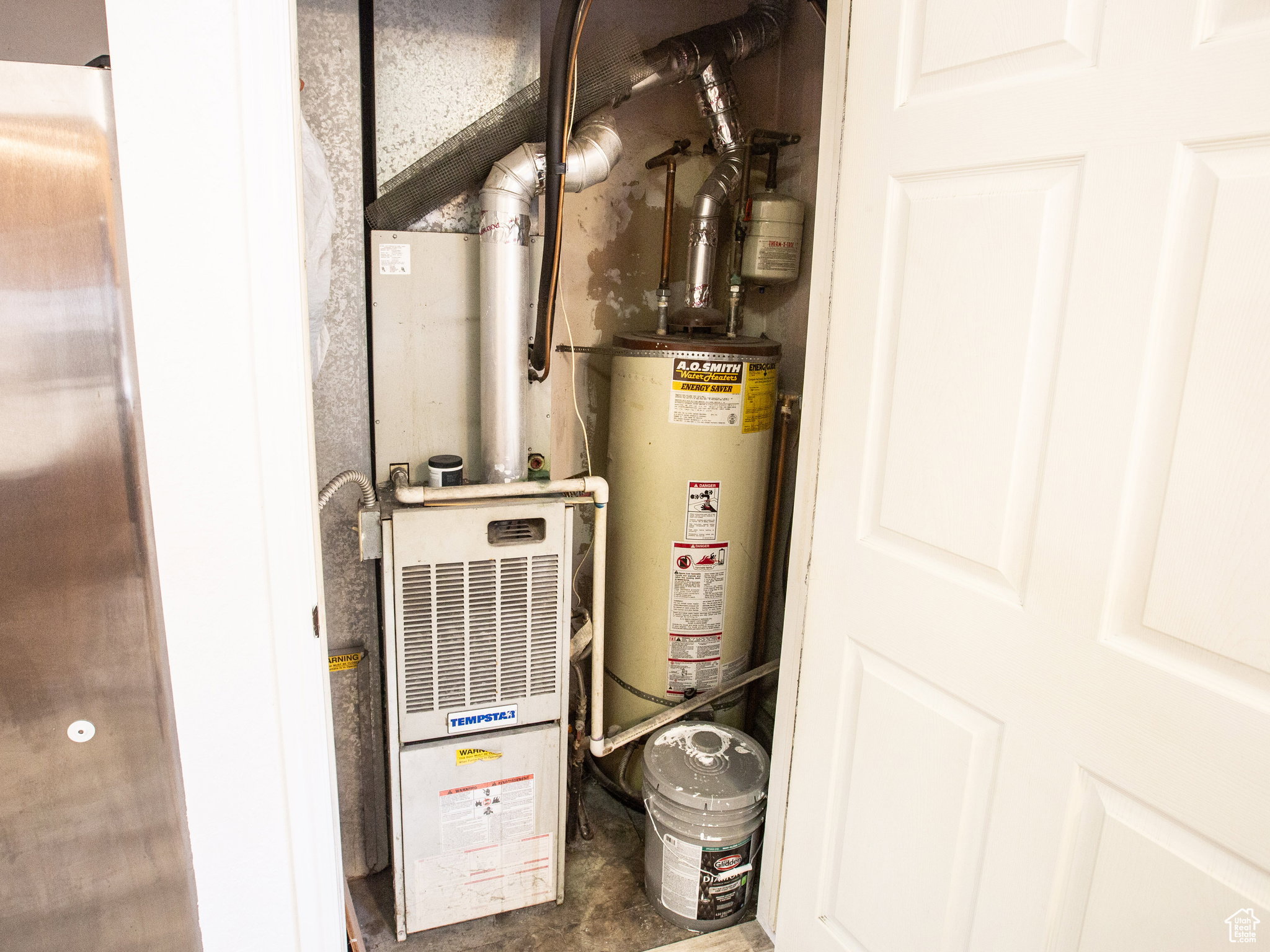 Utilities featuring heating unit and gas water heater