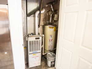 Utilities featuring heating unit and gas water heater