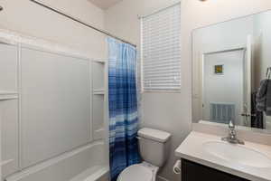 Bathroom featuring vanity and shower / bath combo