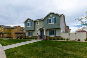 View of front of property featuring a gate and stone siding
