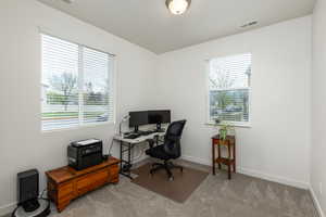 Office with carpet floors and baseboards
