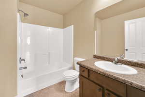 Full bathroom with vanity, shower / washtub combination, and light tile patterned floors