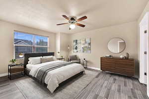Bedroom featuring baseboards and ceiling fan