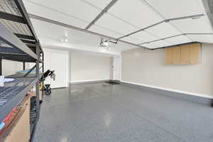 Garage featuring baseboards