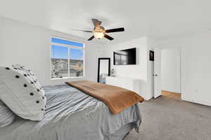 Bedroom with carpet and ceiling fan