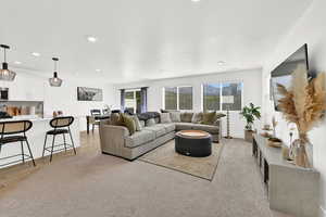 Living area with baseboards and recessed lighting