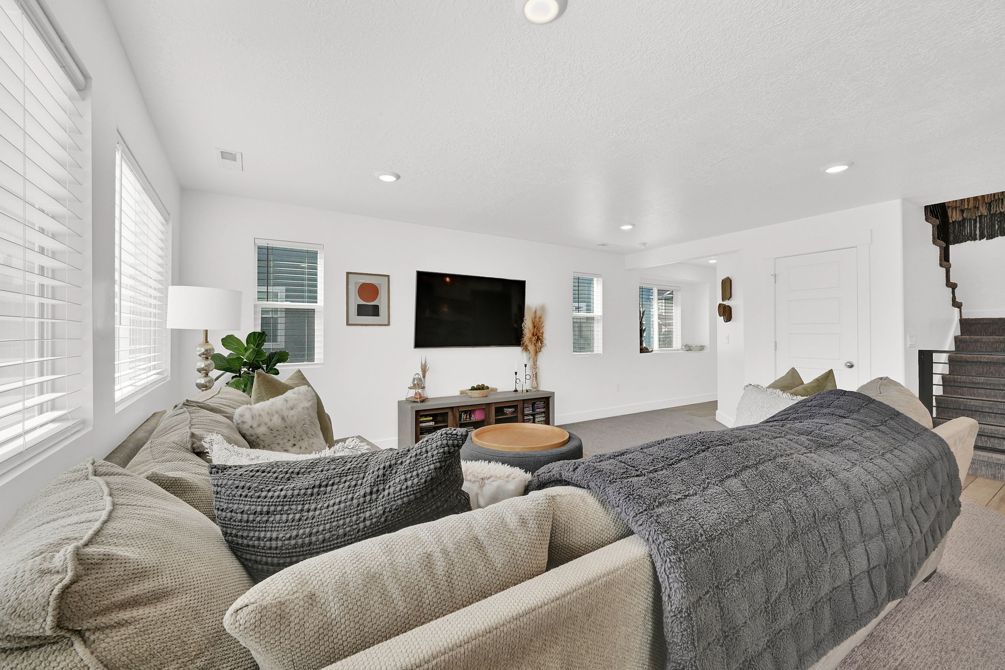 Living room with carpet flooring, recessed lighting, and a textured ceiling
