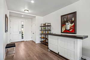 Entryway featuring dark wood-type flooring and recessed lighting