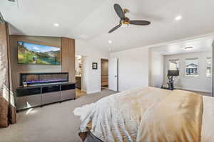Bedroom featuring lofted ceiling, light colored carpet, ceiling fan, and recessed lighting