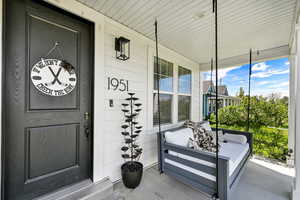 Property entrance with covered porch