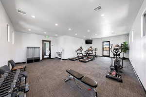 Exercise room featuring recessed lighting