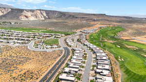 View of property location with a mountain backdrop and nearby suburban area