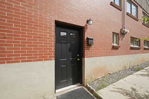 Property entrance with brick siding