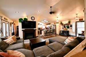 Living area featuring a fireplace and wood finished floors