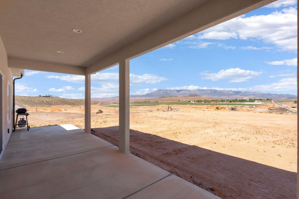 View of patio / terrace featuring a view of countryside, grilling area, and a mountain view