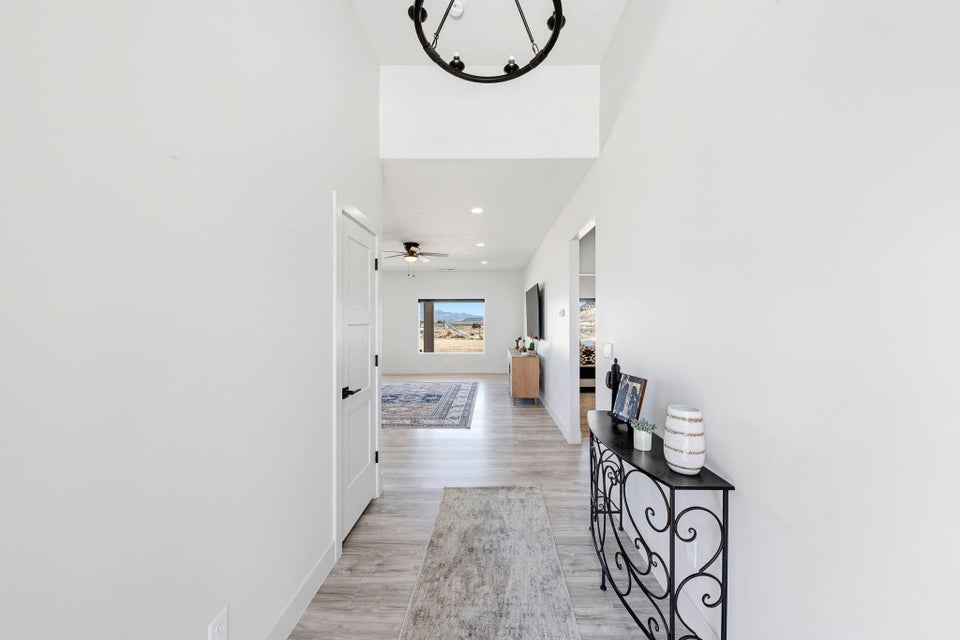Hallway featuring light wood finished floors and recessed lighting
