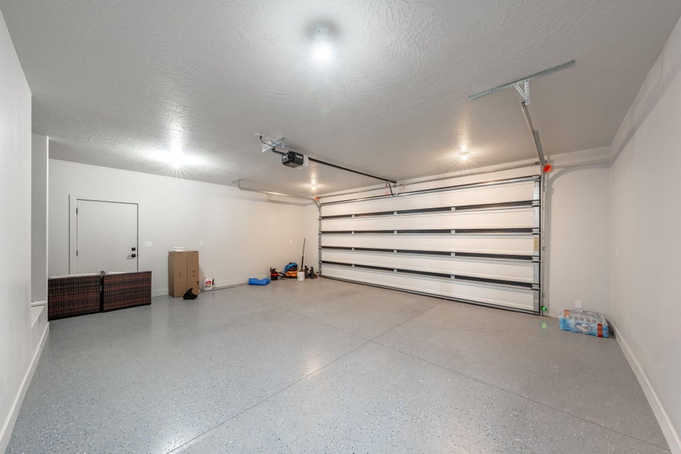 Garage featuring baseboards