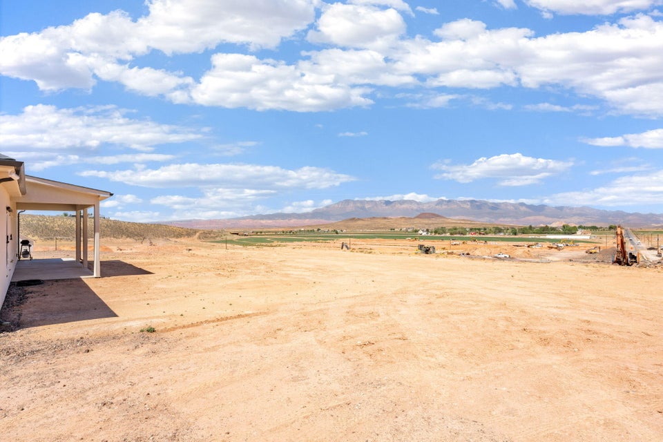 View of mountain backdrop with rural landscape